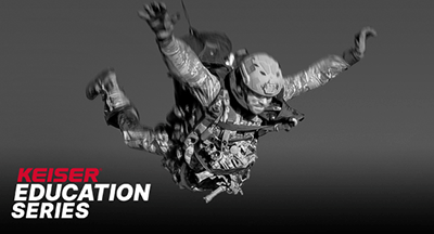 Image of a tactical athlete parachuter free falling with Keiser Education Series Logo