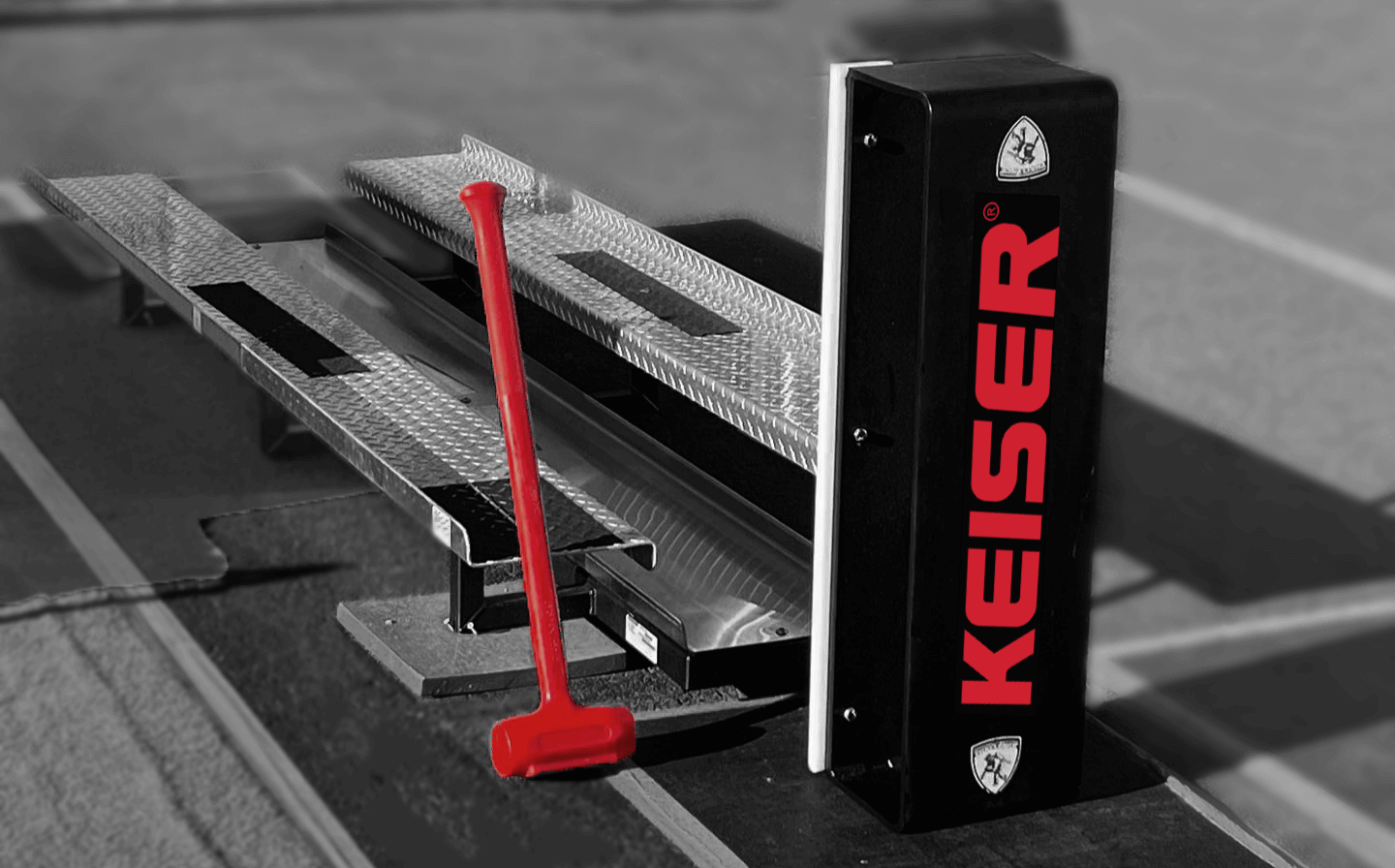 Keiser Force Machine: Black and white image with red pops of color on the logo and hammer.